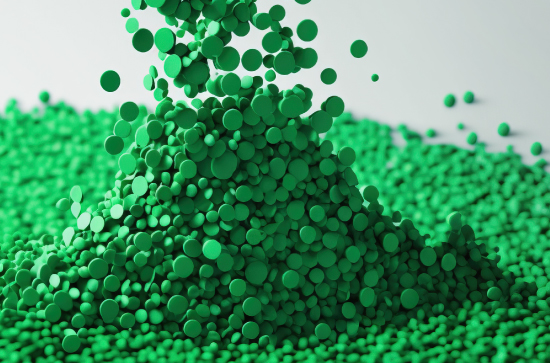 Green hemp Bio-plastics particles spilling in a pile, another versatile advanced material created by Bio Fiber Industries.