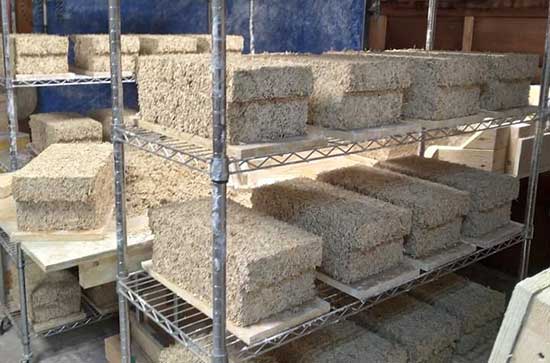 Hempcrete blocks curing on racks at Bio Fiber Industries, another of our industrial hemp products.
